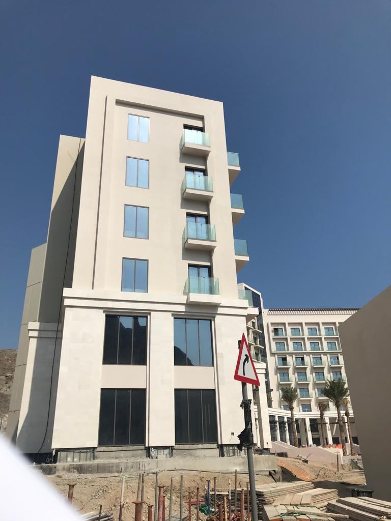 An apartment block with windows and balconies