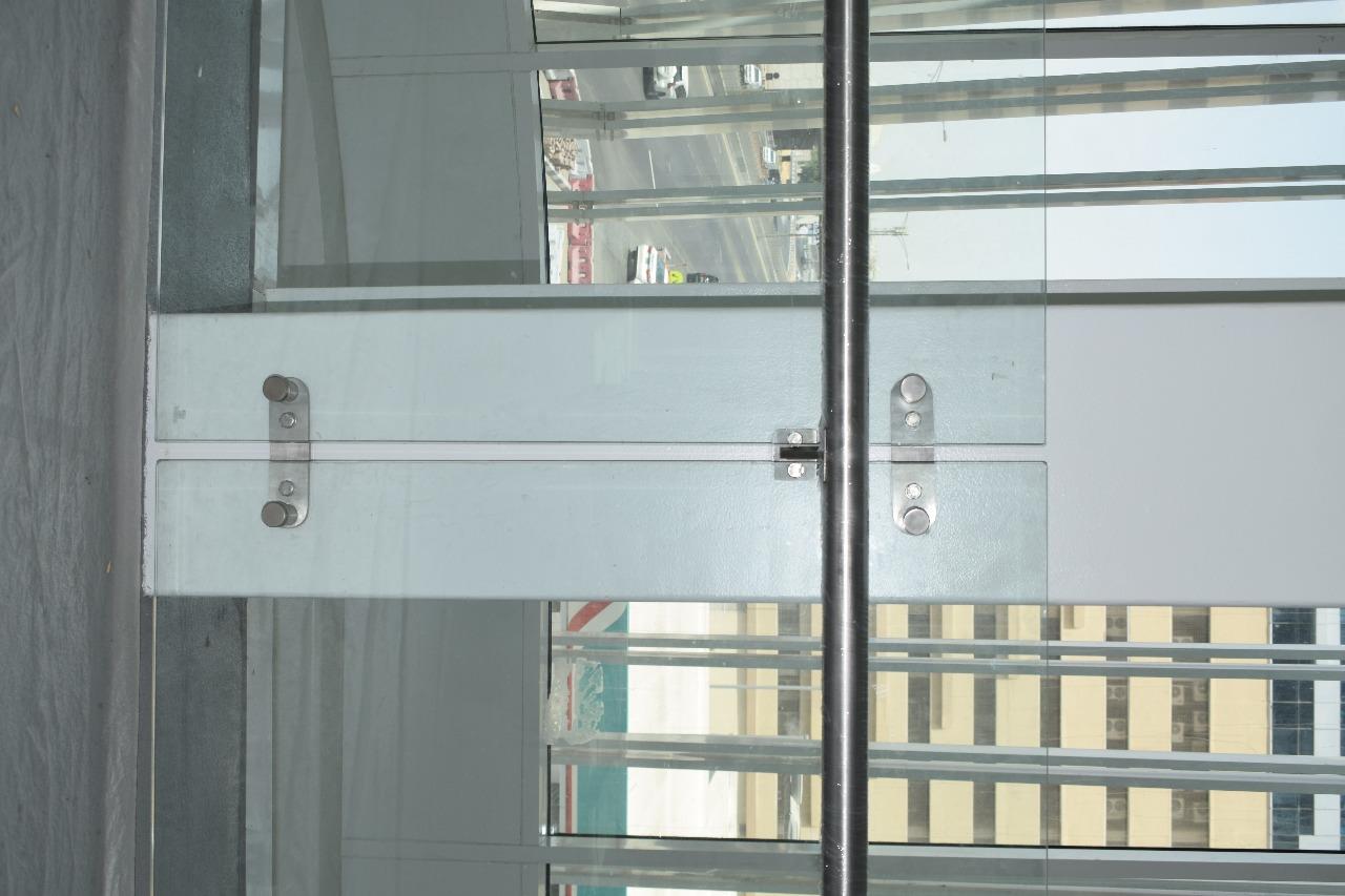 A glass fitting on the walkway glazing