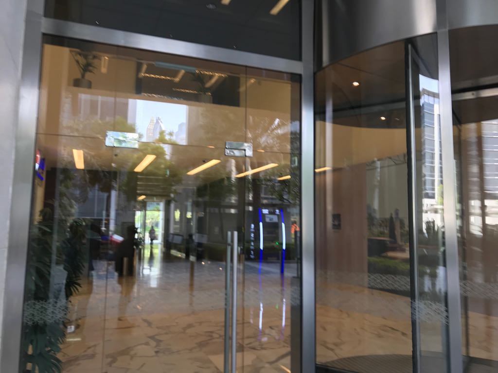 Frameless glass entrance doors and a revolving door