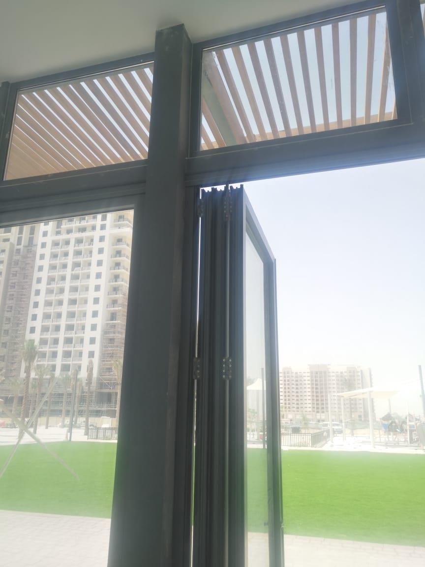 The pergola, seen through a glass door