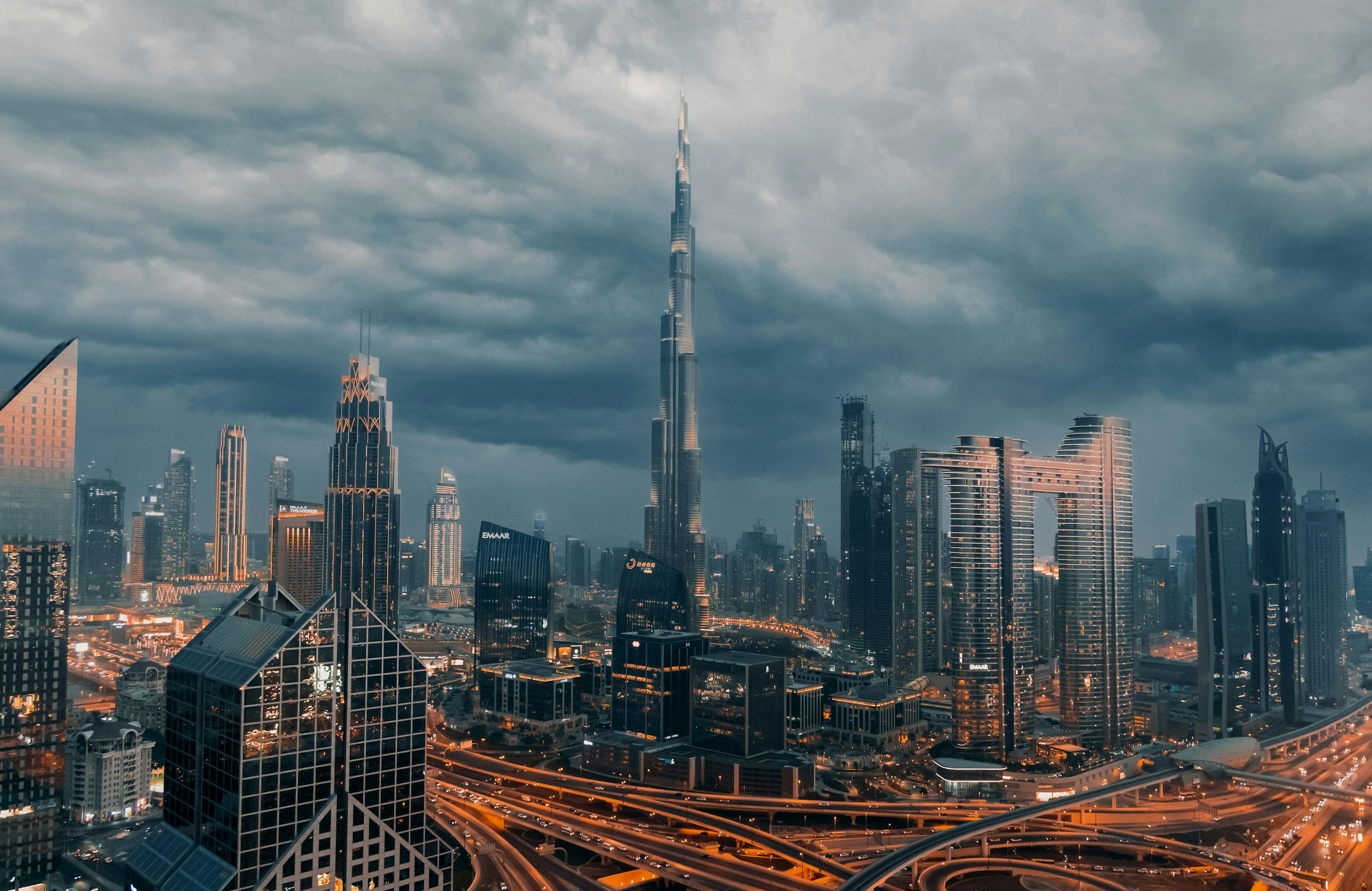 Dubai skyline with the Burj Khalifa under dark clouds
