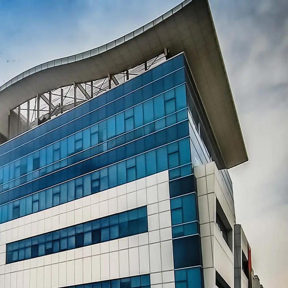 Blue glass curtain wall and white cladding of the Emirates Call Center