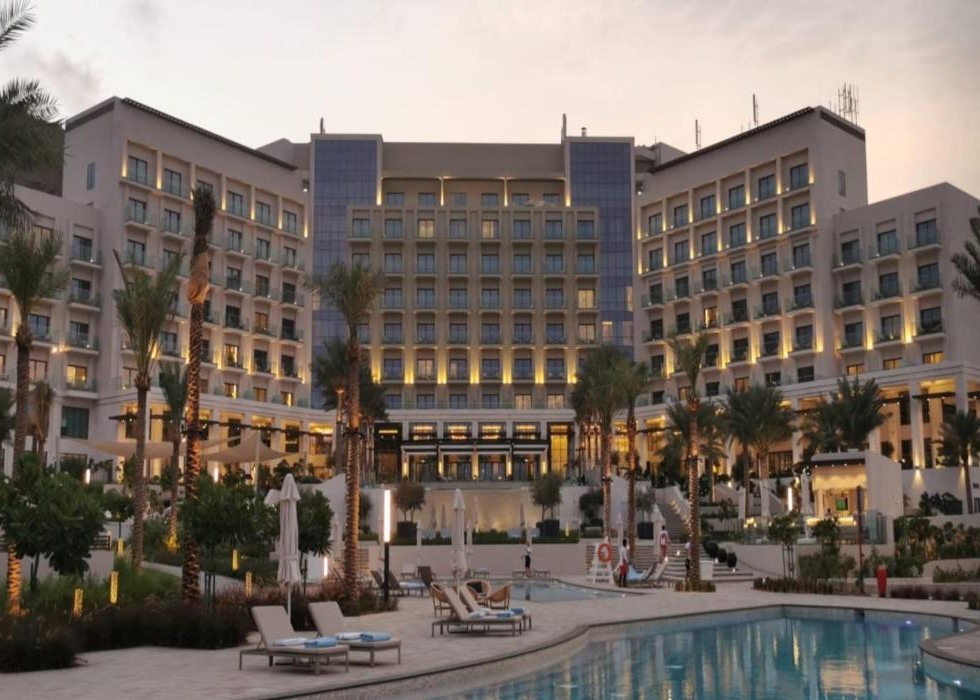 The resort at dusk, with the lit balconies