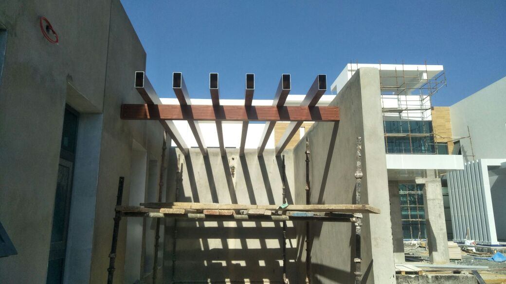 A pergola during installation