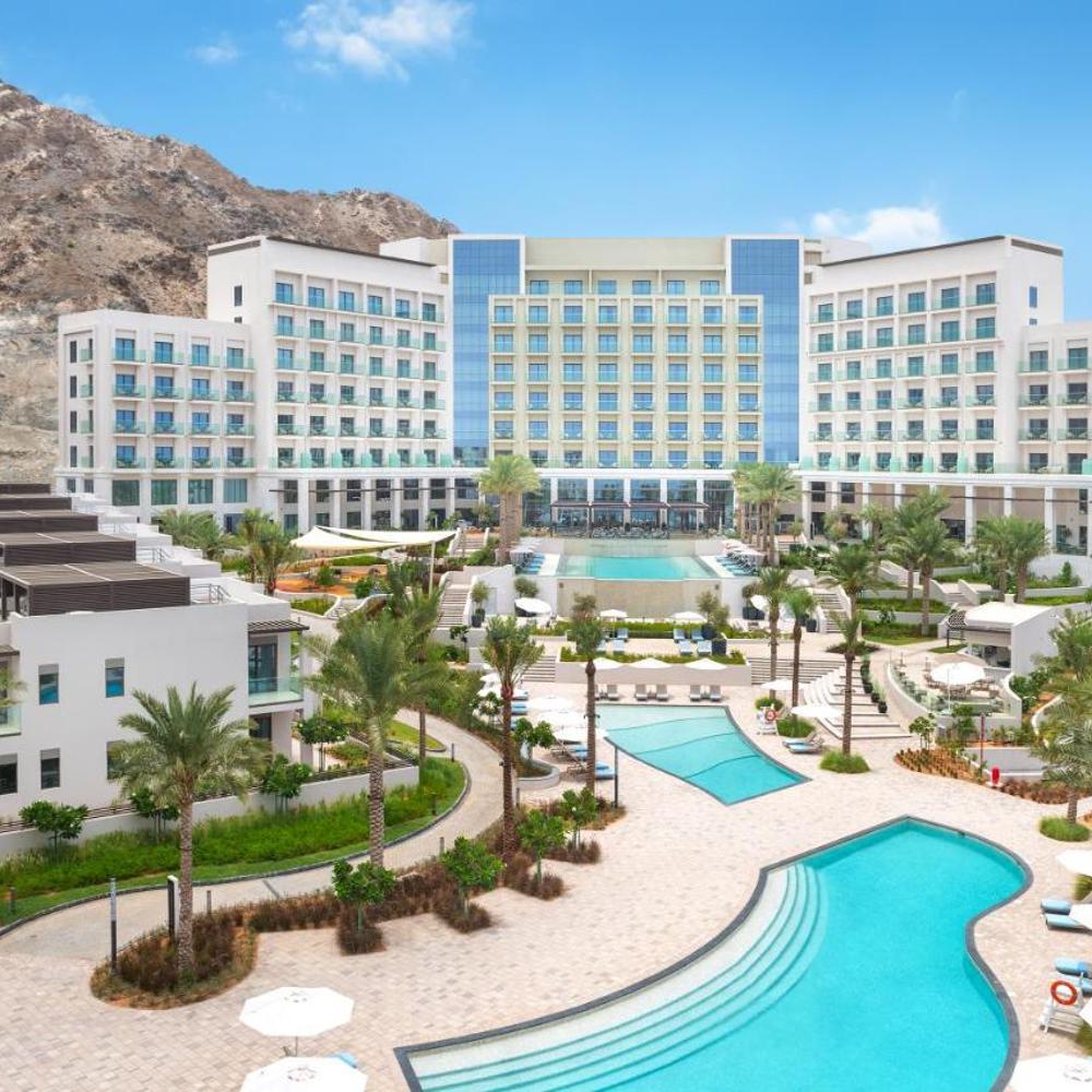 Address Beach Resort Fujairah with pools and mountains