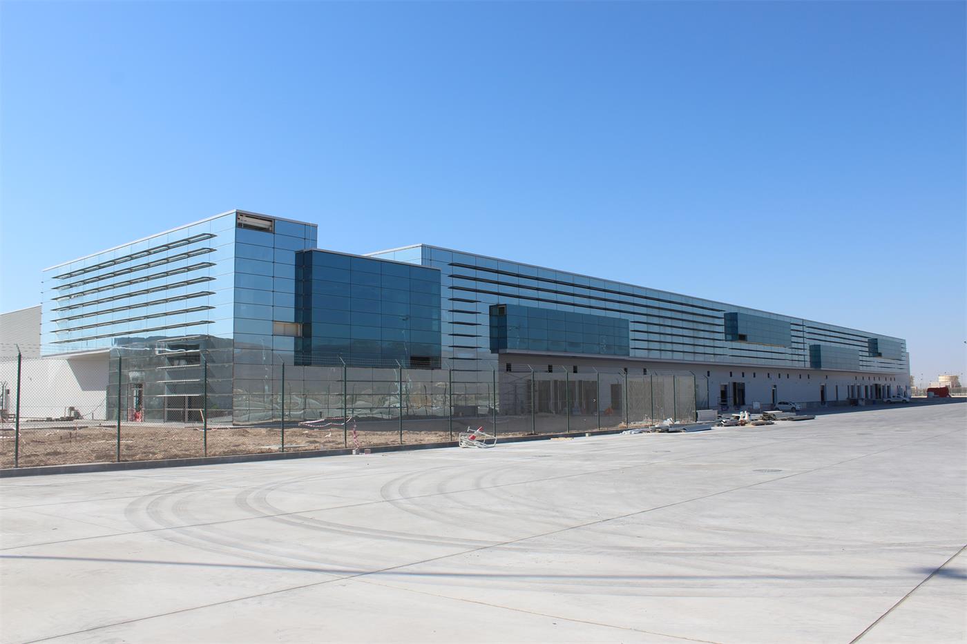 A cargo building with a band of glass