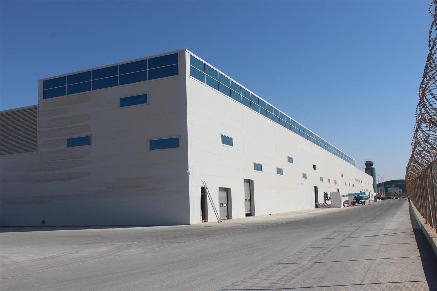 A cargo building clad in metal panels