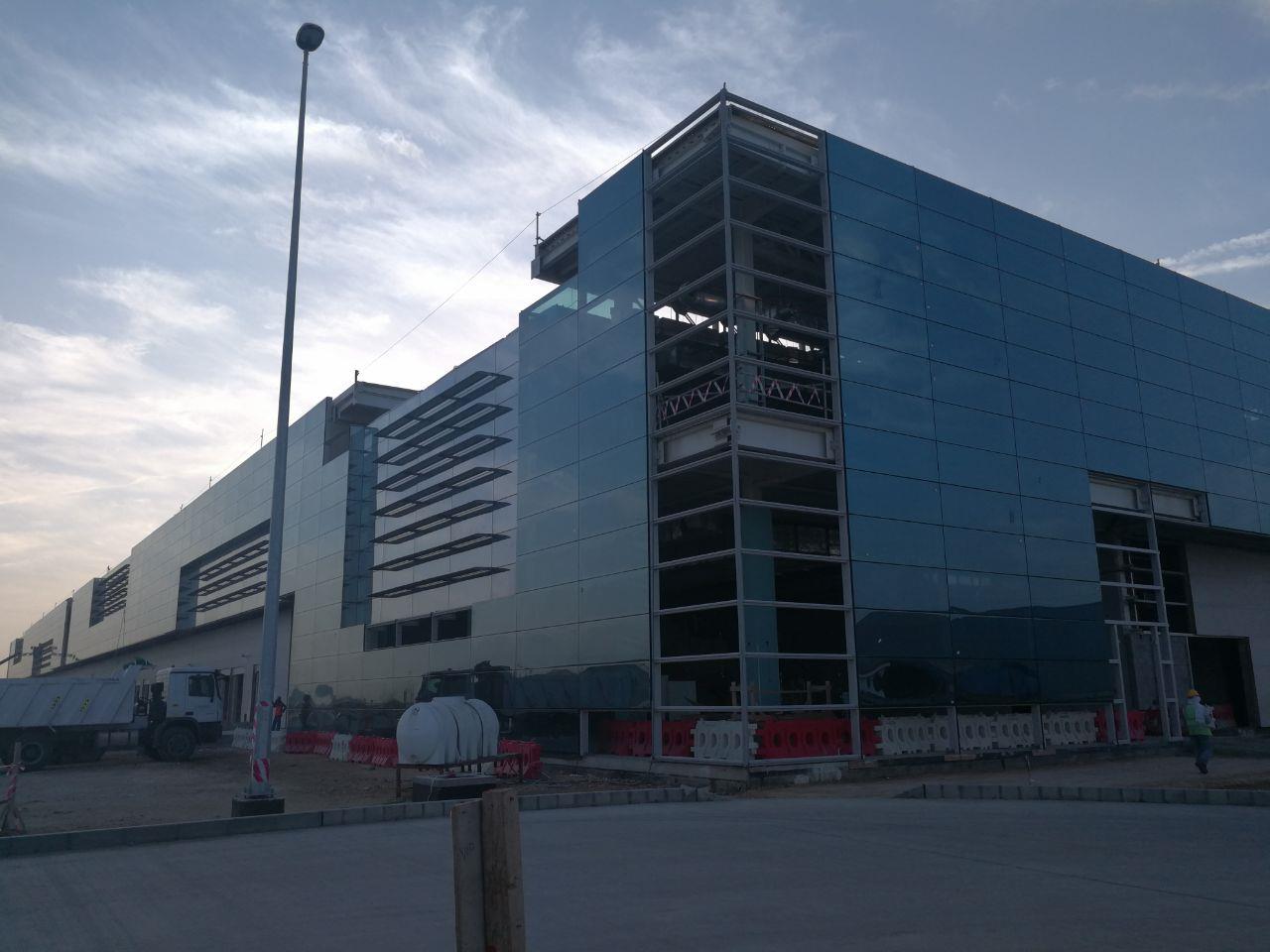 A glass corner of a cargo building