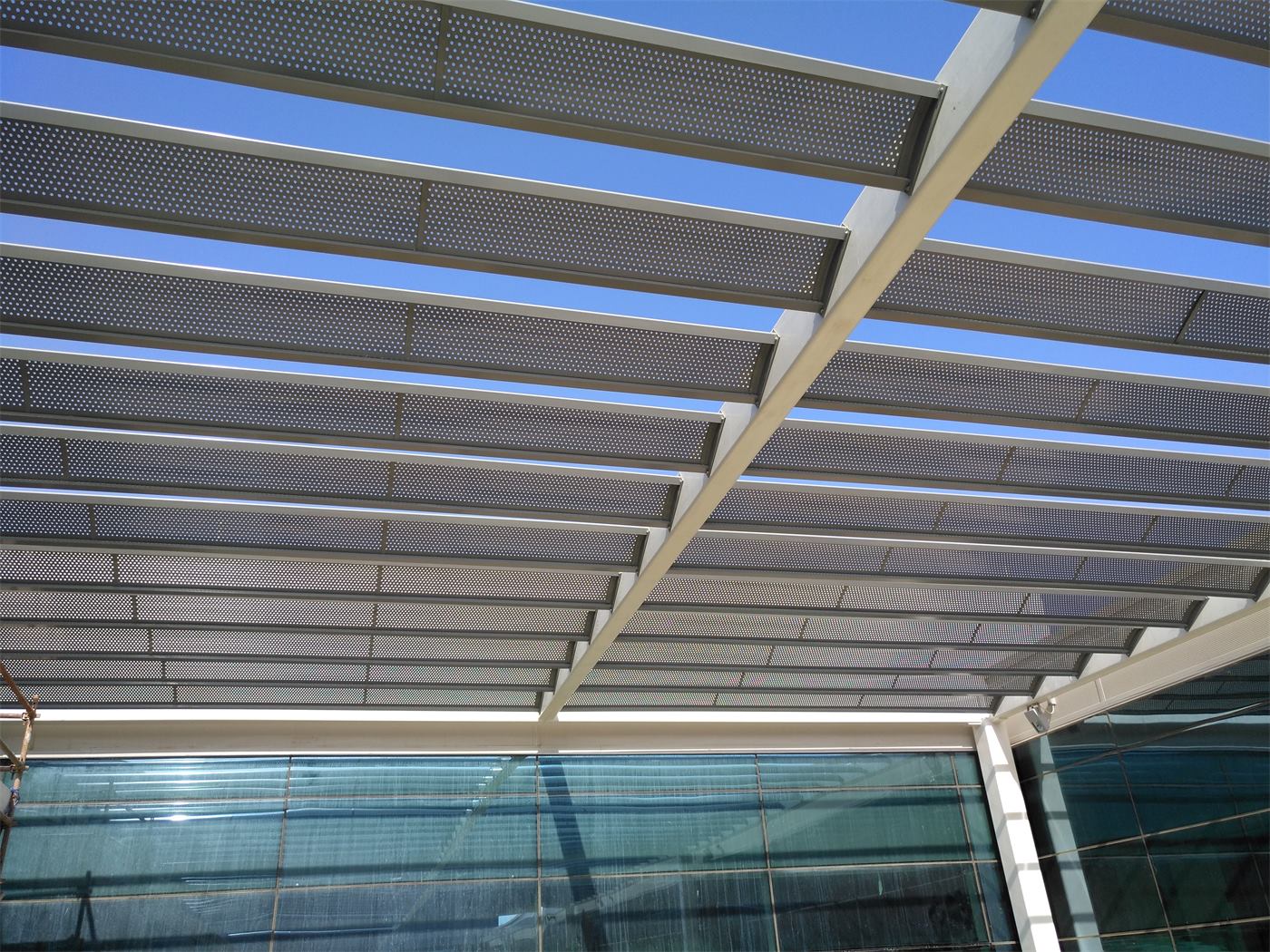 A pergola with aluminium blades