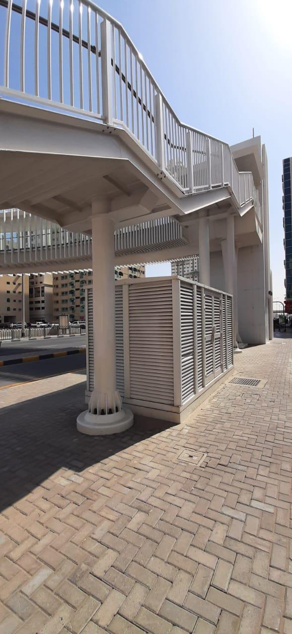 Louvers below a pedestrian bridge stair